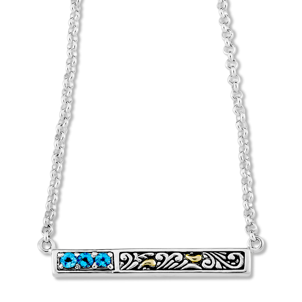 Sterling silver pendant with 18k yellow gold and blue topaz