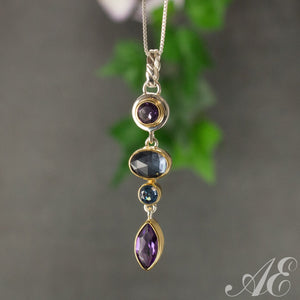 -Sterling silver and 22k vermeil pendant with blue topaz, amethyst and moonstone